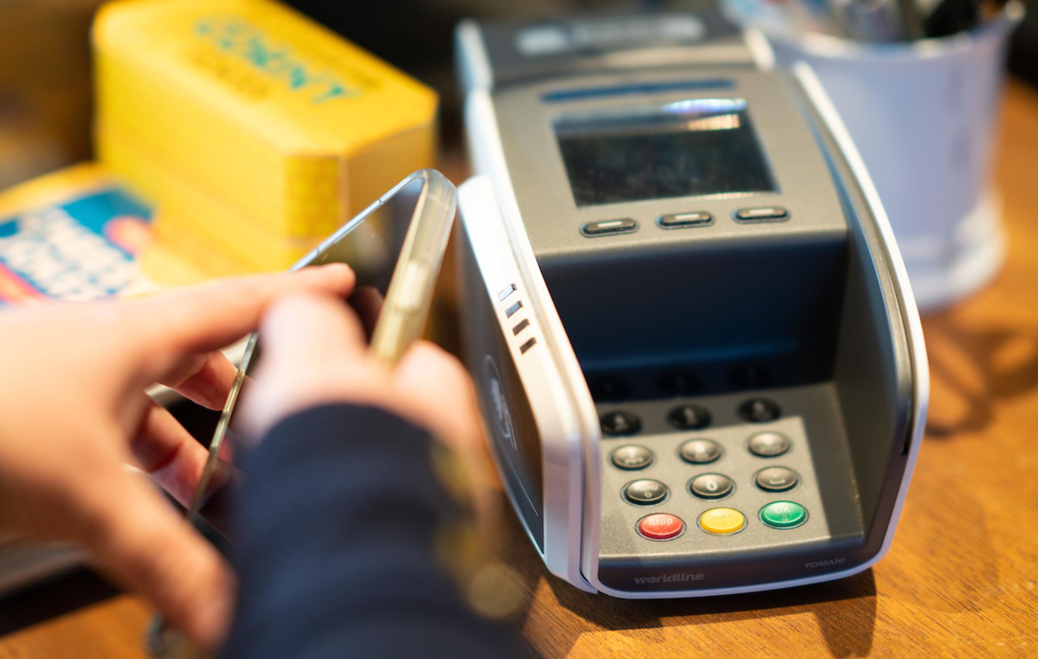 Retail photo of person paying with eftpos