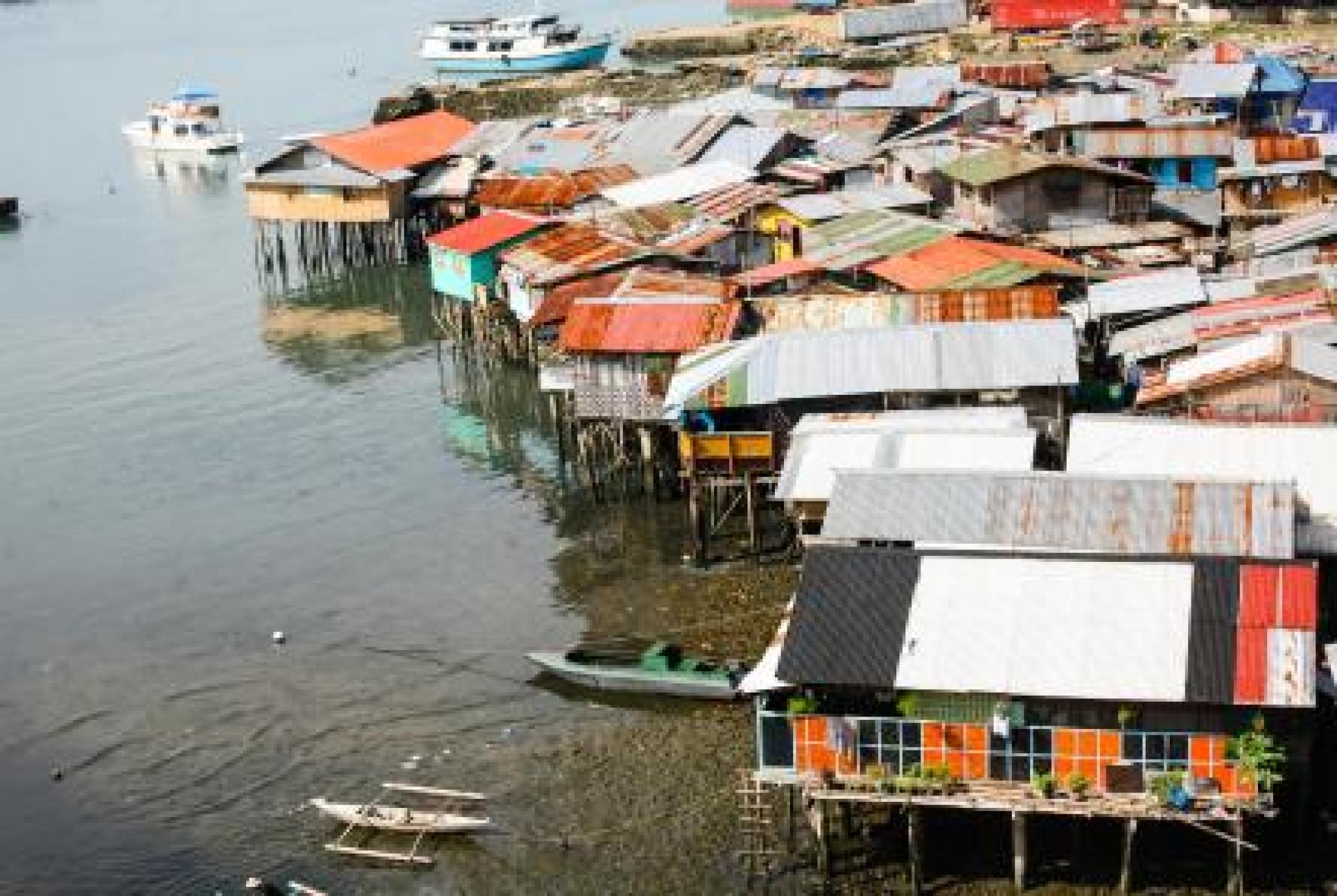 Purchased for editorial and non-editorial use from Shutterstock by CAP - Settlement on water, Cebu City, Philippines